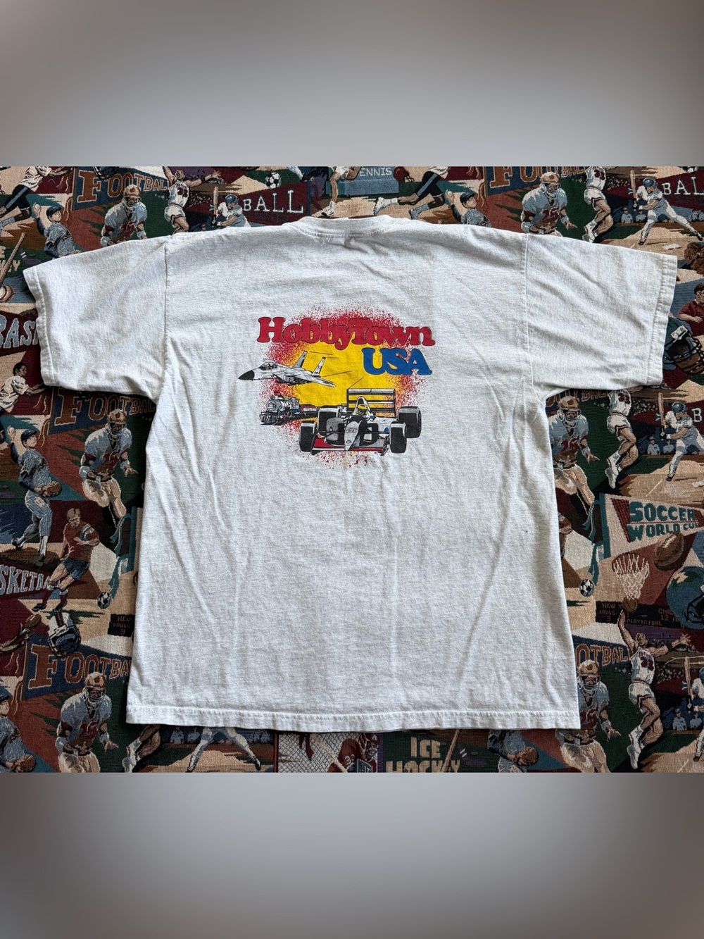 Hobbytown USA Graphic Tee - White with Red/Blue/Yellow Print